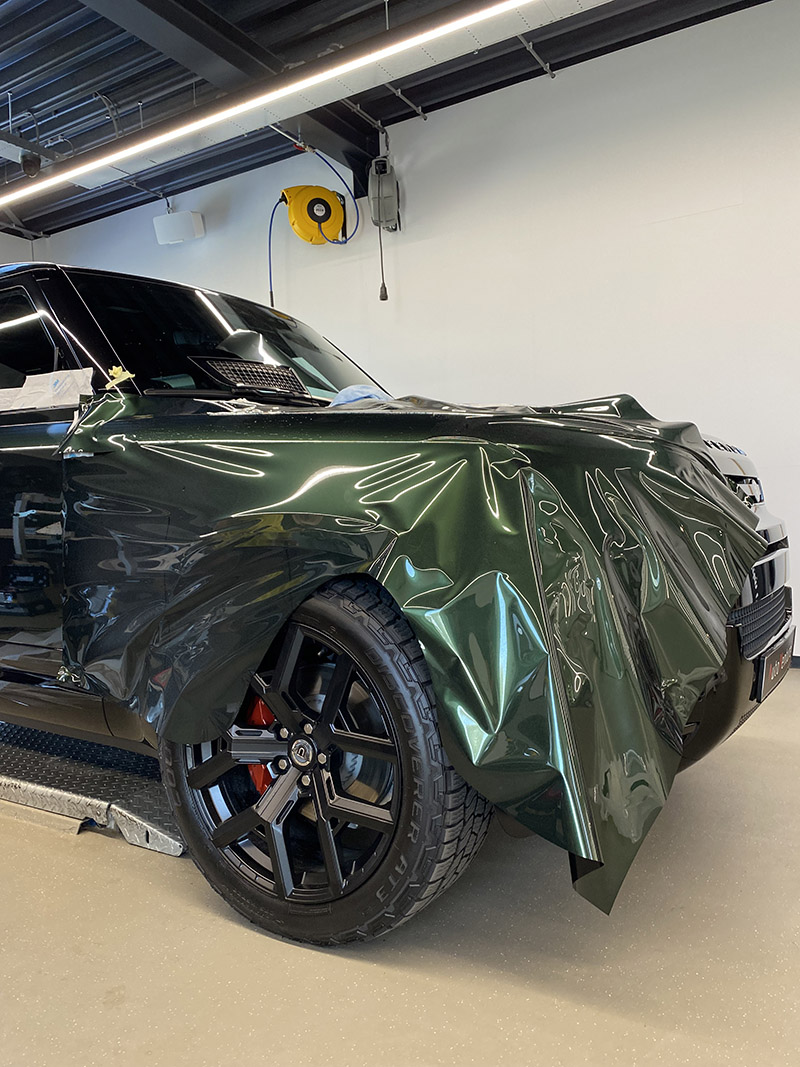 land rover defender 110 metallic midnight green inozetek carwrap